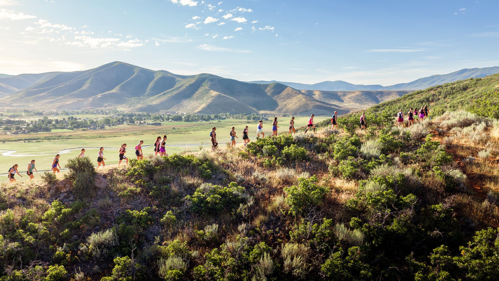 A long line of racers climbing the ridge above the Heber valley.